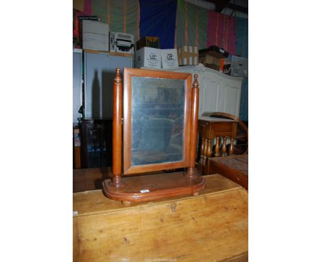 A Victorian toilet mirror on bun feet, 21'' wide x 24'' tall