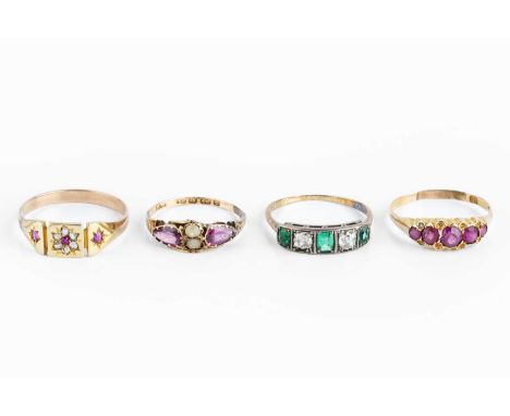 Four dress rings, comprising a diamond and green stone half hoop ring, a diamond and red stone cluster panel ring, and two pi