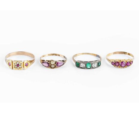 Four dress rings, comprising a diamond and green stone half hoop ring, a diamond and red stone cluster panel ring, and two pi