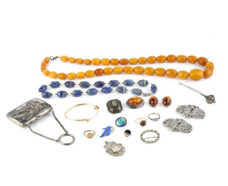 A collection of jewellery, comprising an amber bead necklace, the single strand of amber beads graduating from approximately 