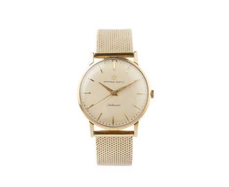 A 9ct gold 'Centenaire' bracelet watch by Eterna-Matic, the circular silvered dial with baton markers and centre seconds hand