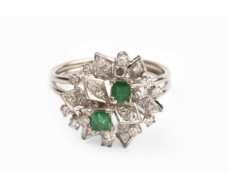 An emerald and diamond dress ring, designed as an abstract tiered cluster of rectangular step-cut emeralds and graduated sing