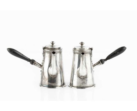 A pair of Edwardian silver bachelor's cafe au lait pots, of plain tapered form, with ebonised side handles, by Harrison Bros 