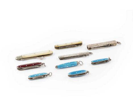 A Continental silver and blue enamel small propelling pencil, with white spotted decoration, stamped 935, 3cm long, two simil