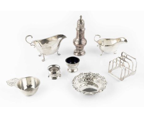 A collection of silver, comprising a baluster sugar castor, Chester 1929, two sauce boats, a five bar toast rack, an embossed