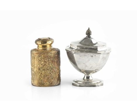 A George V silver tea caddy, of chamfered urn form, with reeded borders, ebonised finial, and pedestal foot, by Thomas Bradbu