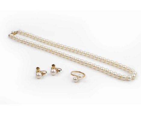 A collection of cultured pearl jewellery by Mikimoto, comprising a single strand necklace, a pair of ear clips and a crossove