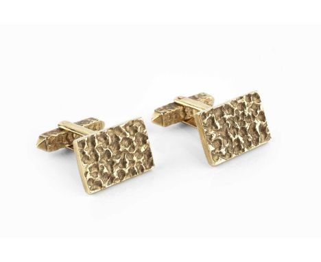 A pair of 9ct gold cufflinks, each rectangular panel with textured abstract decoration, on similarly decorated hinged baton f