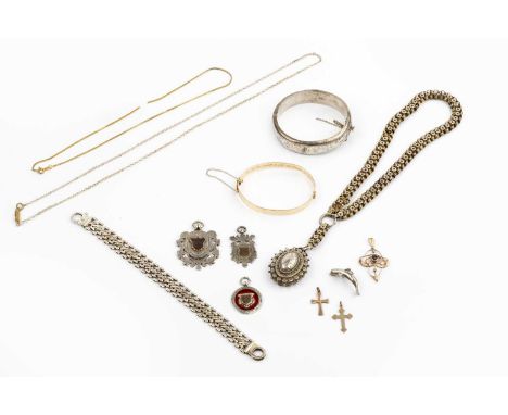 A collection of jewellery, comprising a late Victorian silver locket pendant, hallmarked for Birmingham 1884, suspended from 