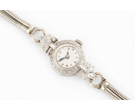 A lady's diamond set cocktail watch, the circular silvered dial with black Arabic numerals and blued steel hands, to a jewell