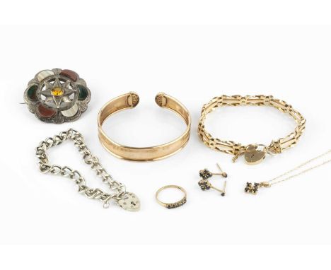 A collection of jewellery, comprising a 9ct gold gate-link bracelet, with padlock clasp, a yellow precious metal torque bangl