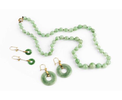 A collection of jade jewellery, comprising a graduated single strand bead necklace, the jade beads graduating from approximat