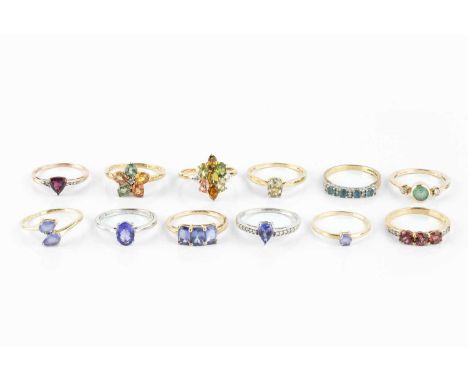 A collection of stone set dress rings, to include a blue stone and diamond half hoop ring, a diamond single stone ring, and f