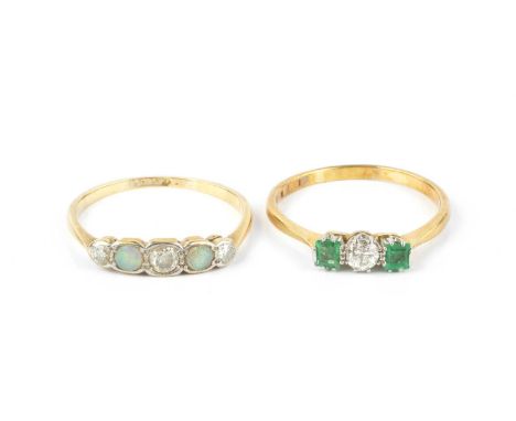 Two diamond and gem set rings, comprising an emerald and diamond three stone ring, the round brilliant-cut diamond claw set b