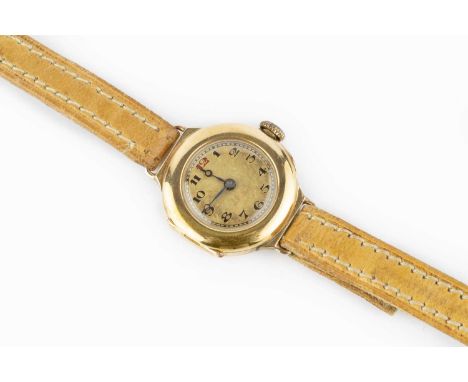 A lady's wristwatch, the circular dial with red and black Arabic numerals, to a jewelled manual wind movement, the yellow pre