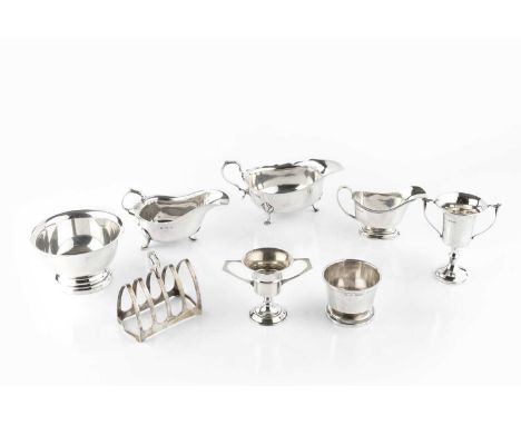 A collection of silver, comprising a sauce boat, with shaped border and scroll handle, by Pearce &amp; Sons, Birmingham 1913;