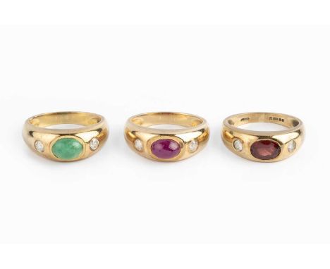 Three gem set dress rings, the first set with an oval cabochon ruby between two circular-cut white stones, yellow precious me