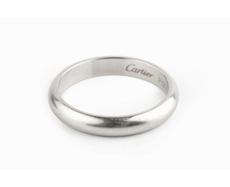 A platinum wedding band by Cartier, of d-section form, signed and numbered FL 2958, cased, ring size O½Scuffs, scratches and 