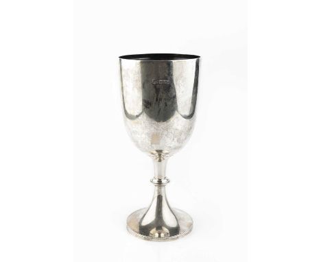 An Edwardian silver trophy cup, of plain design, on beaded circular foot, by Harrison Bros &amp; Howson, Sheffield 1908, 25cm