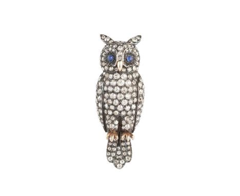 An early 20th century diamond and sapphire set owl, naturalistically modelled in perched position, his body and wings pavé se