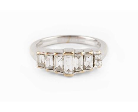 A diamond seven stone ring, designed as a stepped half hoop of graduated baguette-cut diamonds, 18ct white gold mounted, tota