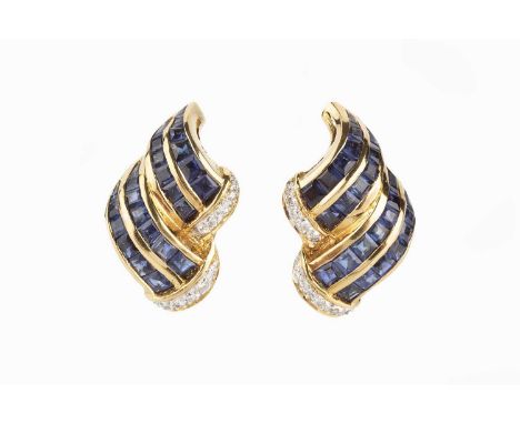 A pair of sapphire and diamond earrings, each accented with channels of graduated square step-cut sapphires, edged with round
