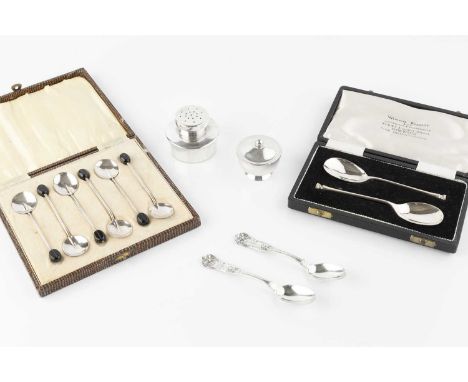 A small collection of silver, comprising a 20th century American silver pepper by Baldwin &amp; Miller, after a design by Pau