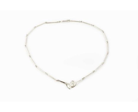 A silver pendant necklace by Lapponia, designed as an abstract panel on a baton-link chain of frosted finish, signed, with si