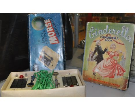A 1950s Fairylite Space Station Morse Code Signlling Set, boxed together with a Collins' Cinderella panorama book of similar 