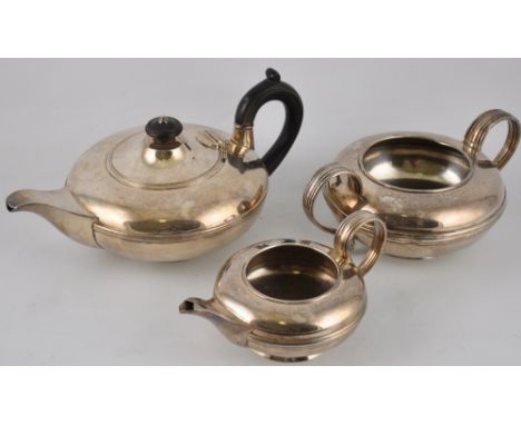 An Art Deco three piece plated tea service, comprising teapot, sugar bowl and milk jug