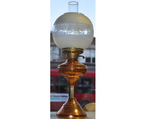 A Victorian style copper oil lamp with opaque shade, a smaller oil lamp together with a plated three branch candlestick