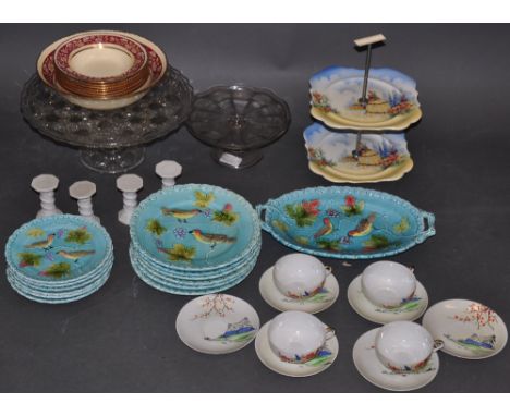 A moulded glass pedestal cake stand, together with another smaller similar, a vintage two tier ceramic example, a set of six 