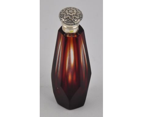 A Victorian stlye silver topped scent bottle with ruby iridescent glass