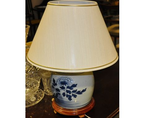 A late 19th century blue and white ginger jar, now converted as a table lamp decorated with flowers, H. 48cm.