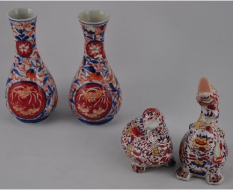 A pair of Imari baluster shaped vases, H. 17.5cm, together with two ceramic duck figures decorated in the same palette (4)