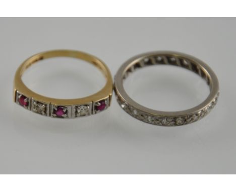A white metal eternity ring, together with a 9ct diamond & ruby half-eternity ring (2)