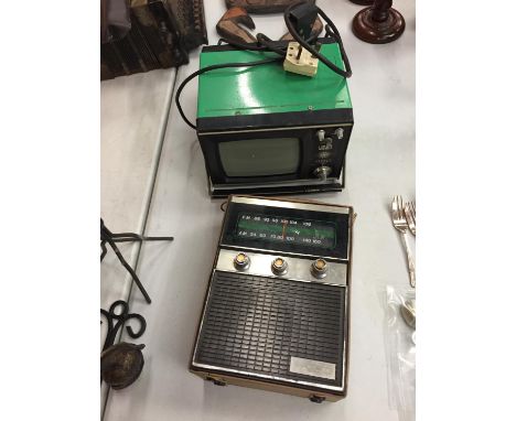 A VINTAGE VEGA 402 PORTABLE TV AND A RADIO 