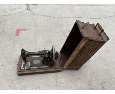 A VINTAGE SINGER SEWING MACHINE 