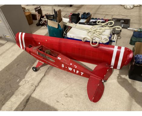 A MODEL AREOPLANE WITH NO ENGINE AND REQUIRING RESTORATION 