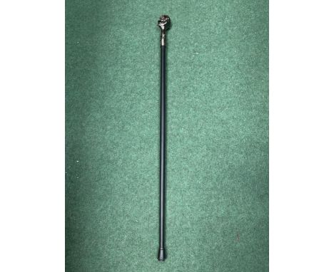 A WALKING STICK WITH SKULL HEAD DECORATION 