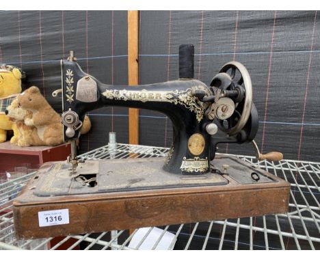 A VINTAGE SINGER SEWING MACHINE 