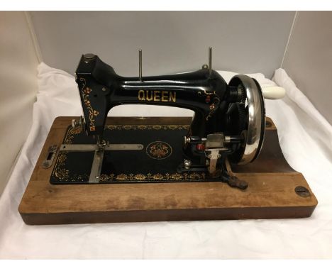 A VINTAGE 'QUEEN' SEWING MACHINE 