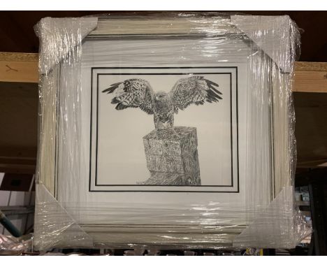A FRAMED BLACK AND WHITE PICTURE OF A KESTREL ON A GATE POST 