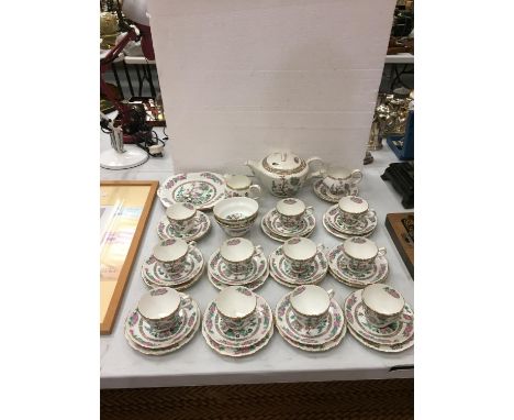 A VINTAGE COLLECTION OF A GROSVENOR FLORAL CHINA TEA SET TO INCLUDE 11 TRIOS, TWO MILK JUGS , TEA POT AND TWO CAKE PLATES 