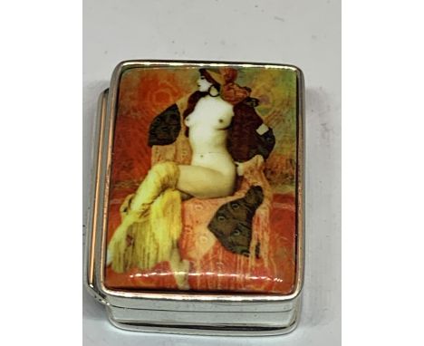 A SILVER PILL BOX WITH AN ENAMEL EROTIC DESIGN LID 