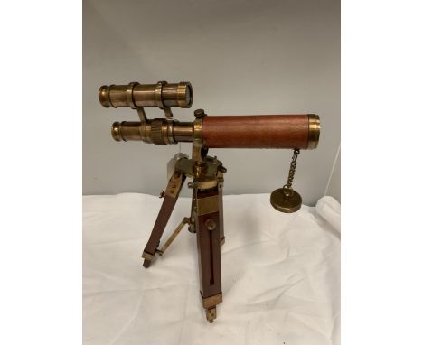 A BRASS, WOOD AND LEATHER TELESCOPE ON TRIPOD STAND 