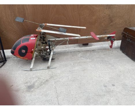 A MODEL HELICOPTER POWERED BY O.S ENGINE 