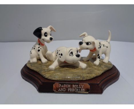A ROYAL DOULTON DISNEYS 101 DALMATIANS 'PATCH, ROLLY AND FRECKLES' 