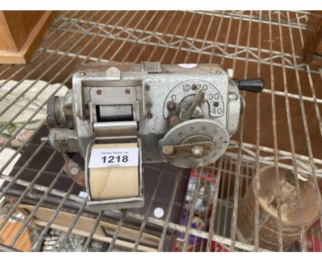 A VINTAGE BUS CONDUCTORS TICKET MACHINE 