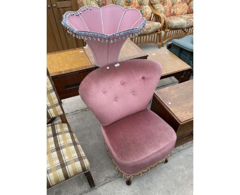 A PINK BEDROOM CHAIR ON CABRIOLE FRONT LEGS AND SIMILAR STANDARD LAMP SHADE 